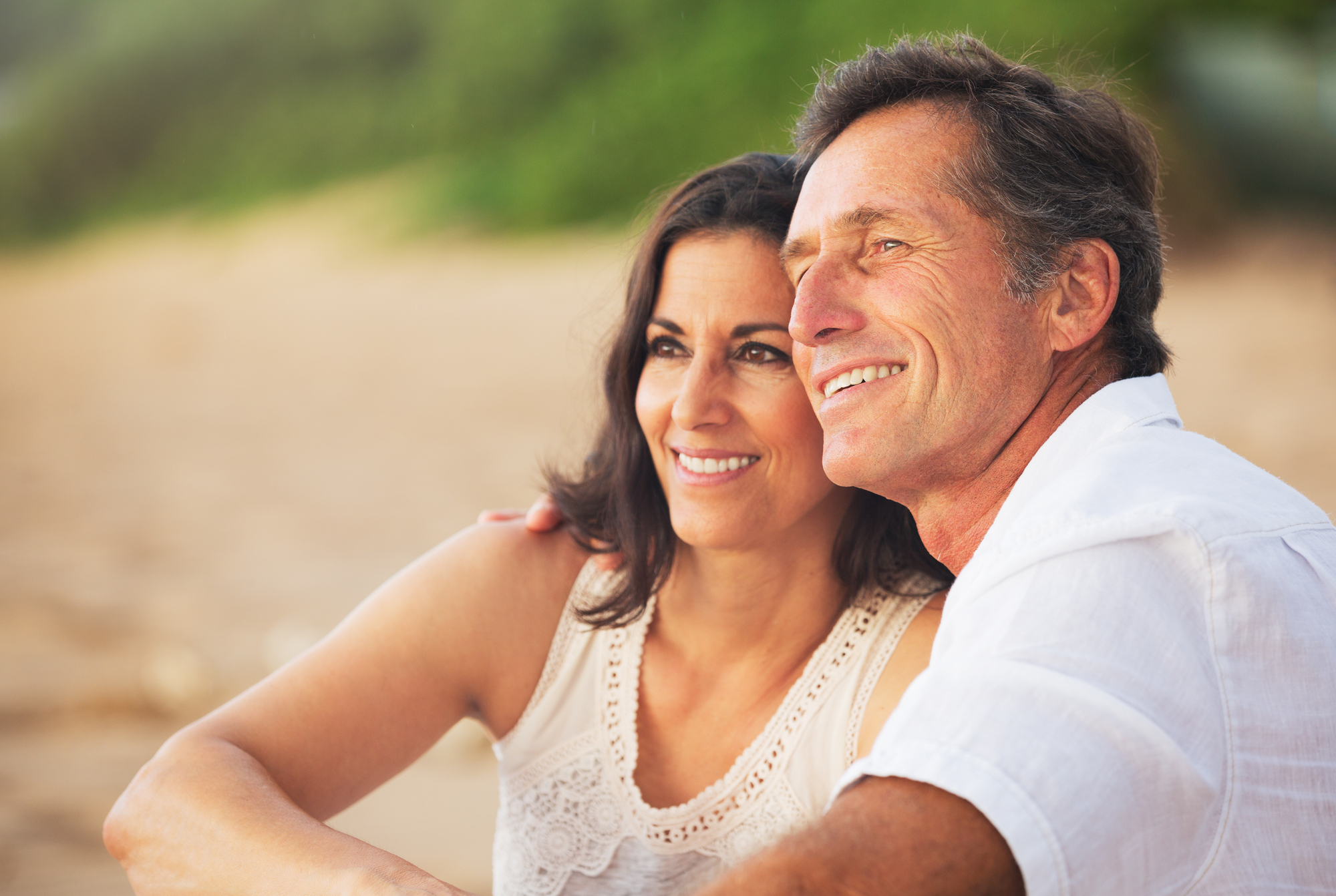 Mature Couple Enjoying Sunset on the Beach, Norfolk property management