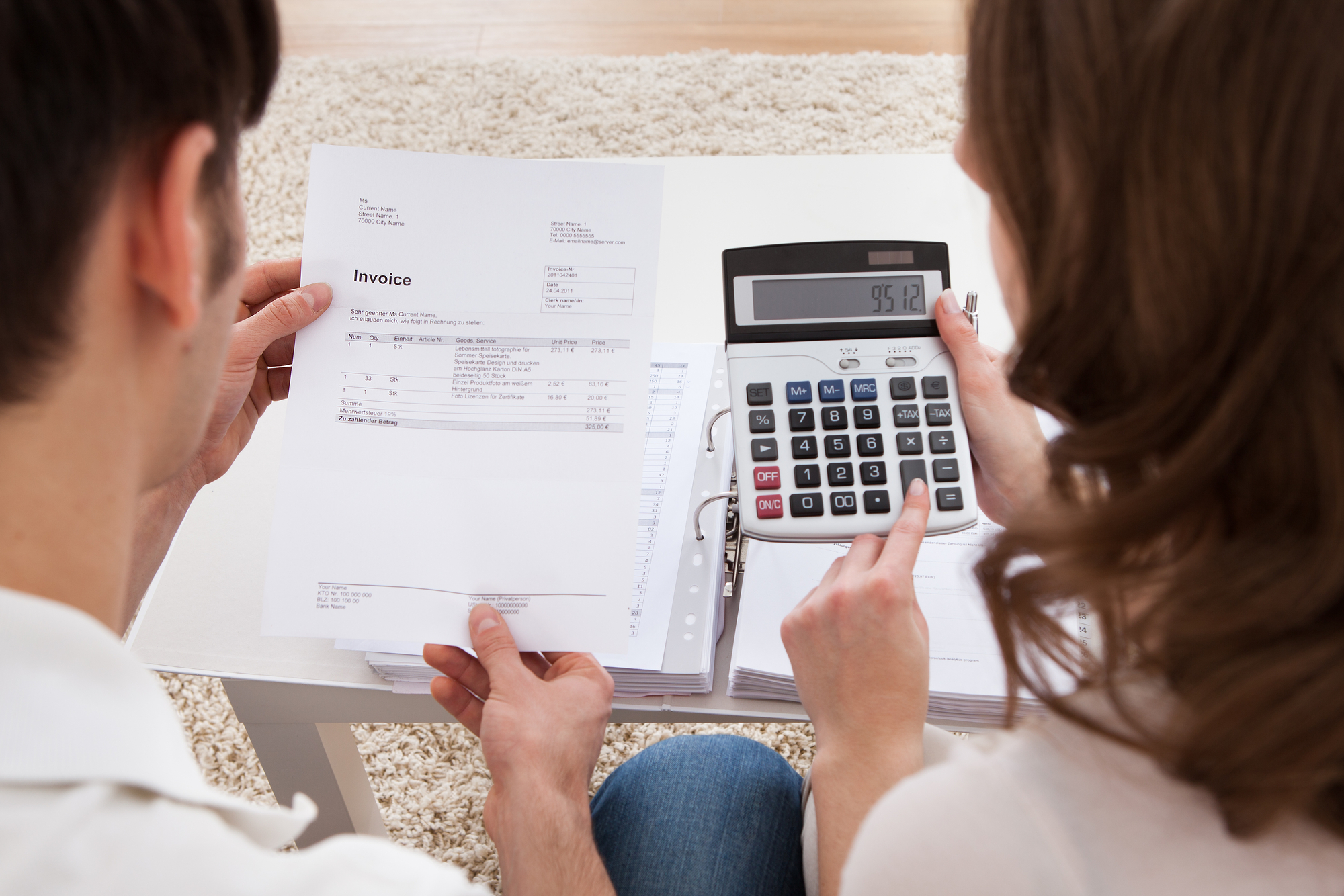 Young couple calculating budget